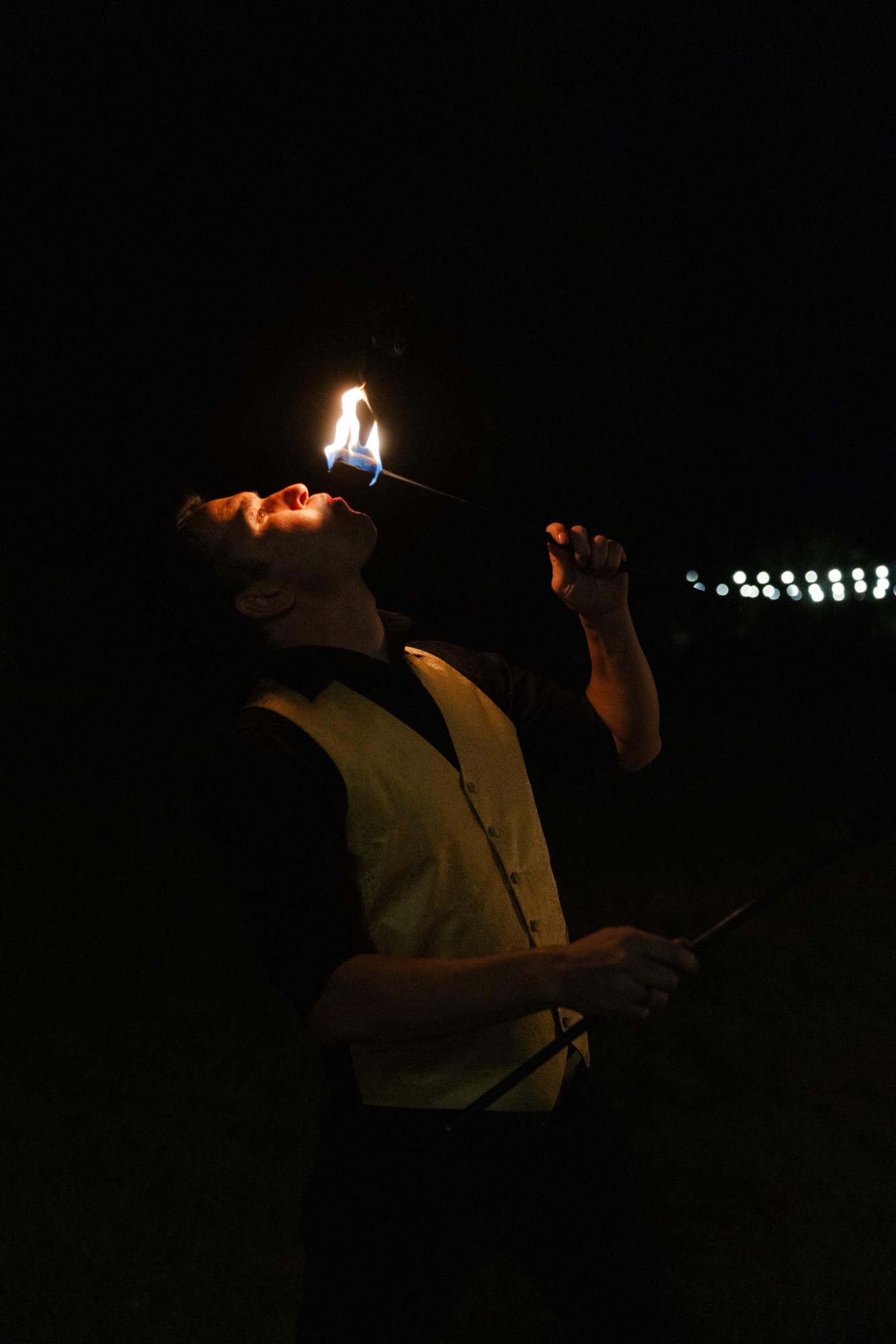 Fire eating performer
