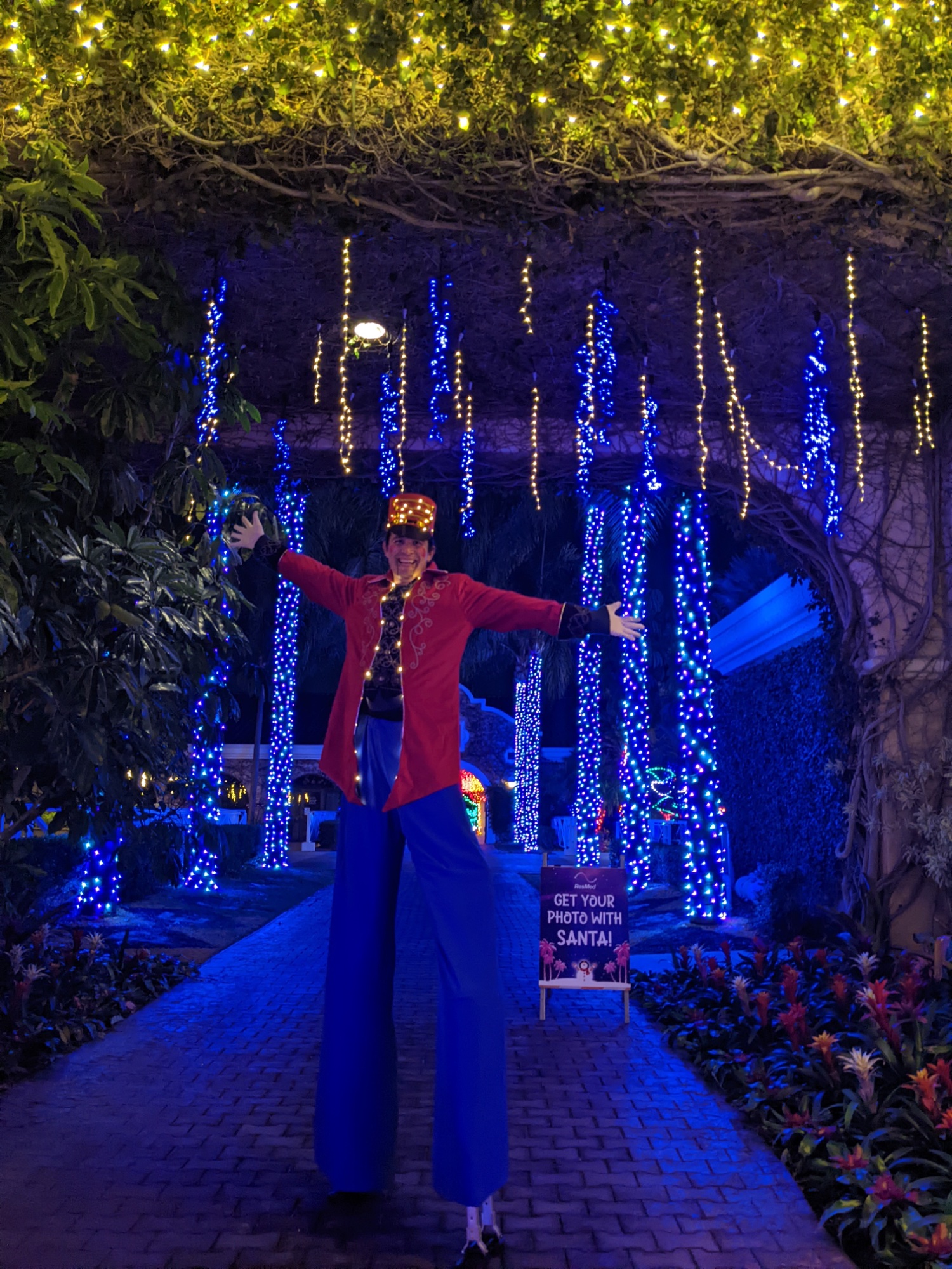 Stilt walker holiday lights